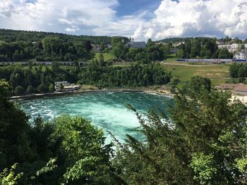 Scenic view of waterfall against sky