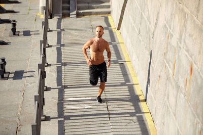 Full length of woman walking on street