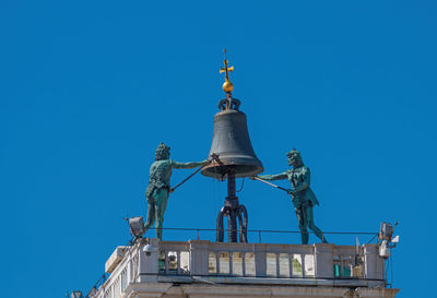 Low angle view of building against blue sky