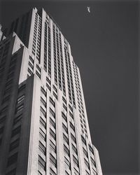 Low angle view of skyscraper against clear sky