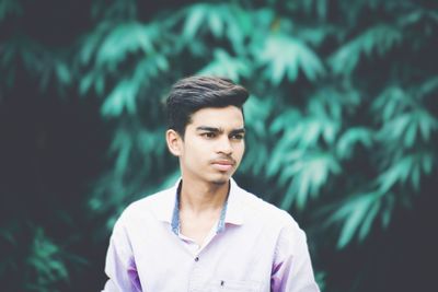 Portrait of young man standing outdoors