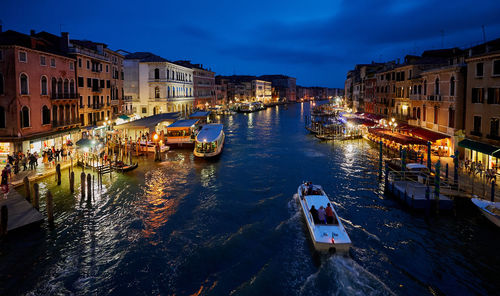 High angle view of canal in city at dusk