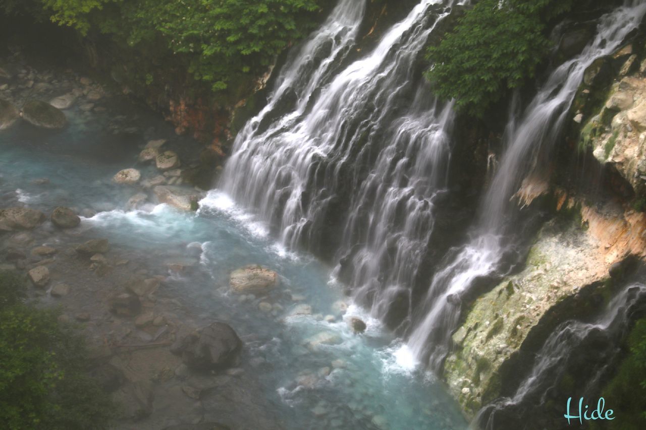 WATER FLOWING THROUGH ROCKS