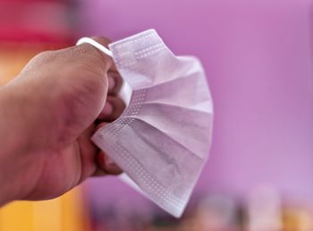 Close-up of hand holding paper