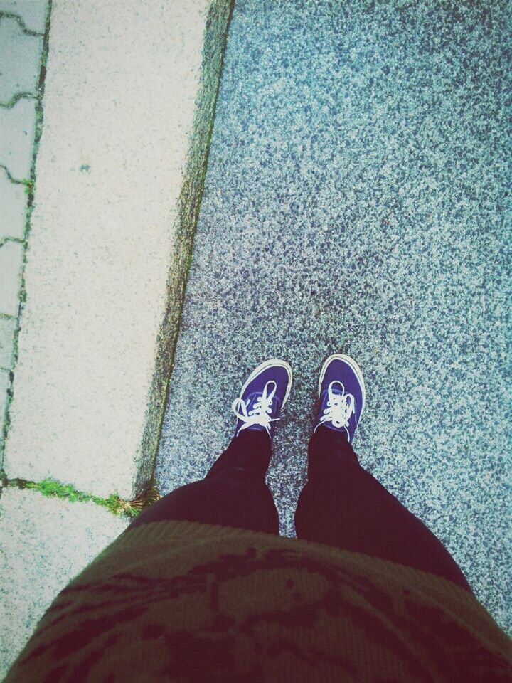 low section, person, shoe, personal perspective, footwear, standing, high angle view, blue, human foot, unrecognizable person, lifestyles, jeans, street, day, outdoors, men, part of