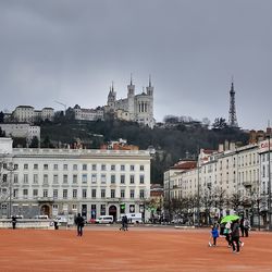 Group of people in front of buildings