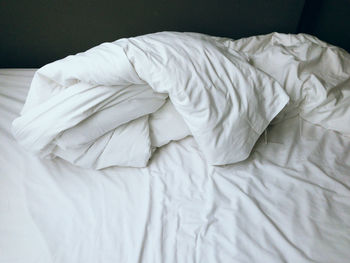 High angle view of messy bed