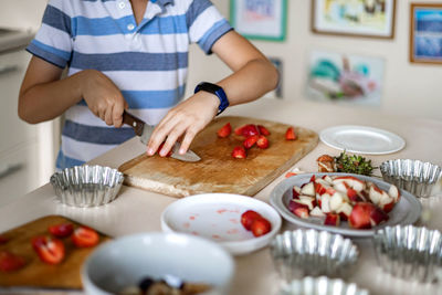 Man preparing food on cutting board