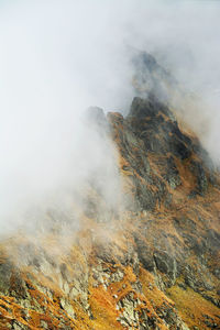 Scenic view of cloud covered mountain