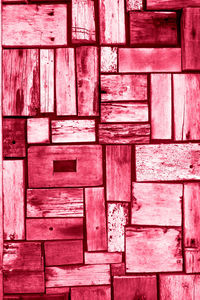 Wood texture - ecological background. vintage viva magenta color of 2023, bricks are merged