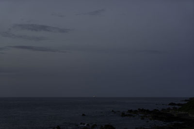 Scenic view of sea against sky at dusk