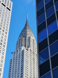 Low angle view of modern buildings against sky