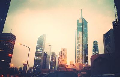 Low angle view of modern buildings against sky