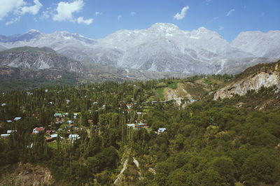 Scenic view of green landscape against mountains