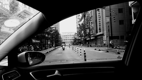 Street seen through car window