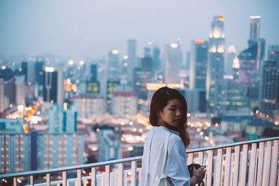 Woman standing in city