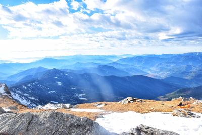 Scenic view of snowcapped mountains against sky