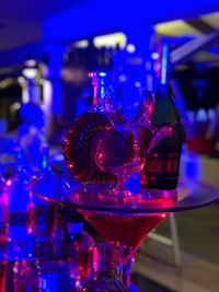 Close-up of wine glasses on table