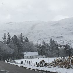 View of snow covered mountain against cloudy sky