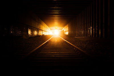 View of railroad tracks at sunset