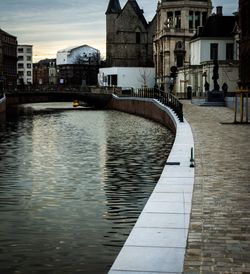 Canal amidst buildings in city