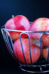 Close-up of apples in plate on table