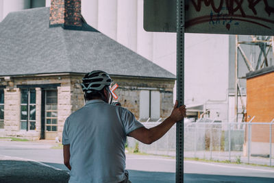 Rear view of man standing on street