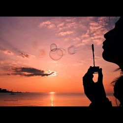 Scenic view of sea at sunset