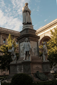 Low angle view of statue against sky