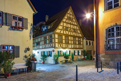 Buildings in city at night