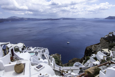 Santorini, greece, may 5, 2024. oia. traditional architecture with white houses facing the sea.