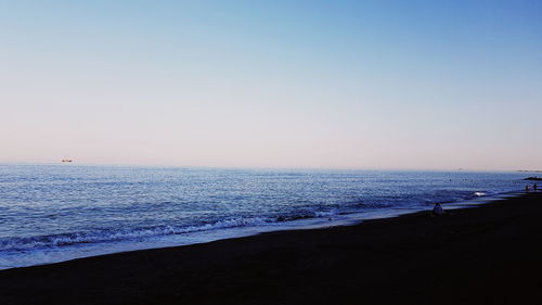 Scenic view of sea against clear sky during sunset