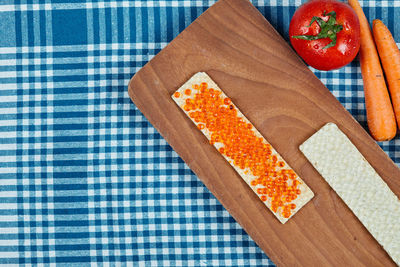 High angle view of fruits on cutting board