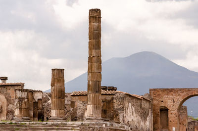 View of the ruins of pompeii with the volcano in the background