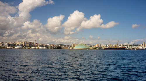 City by sea against sky