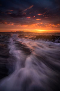 Scenic view of sea against sky during sunset