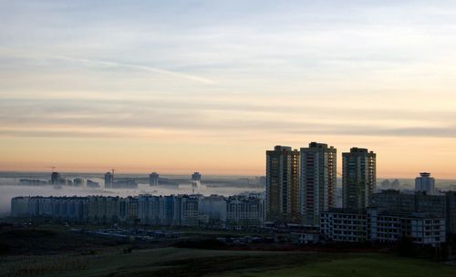 Buildings in city at dusk