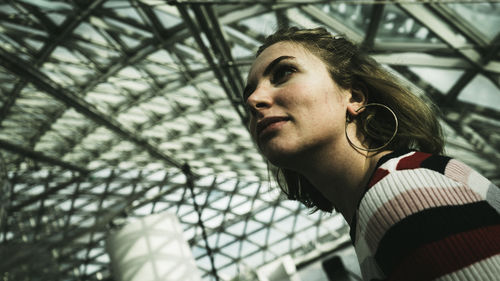 Low angle portrait of young man looking away