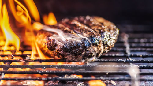 Close-up of meat on barbecue grill