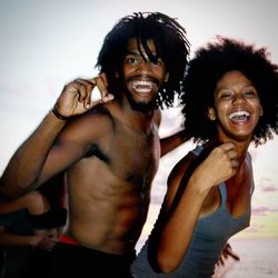 Portrait of happy couple against clear sky