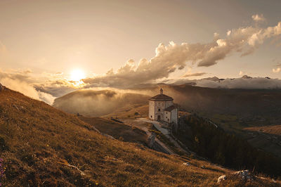 Panoramic shot of building against sky during sunset