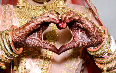 Close-up of woman hand with heart shape