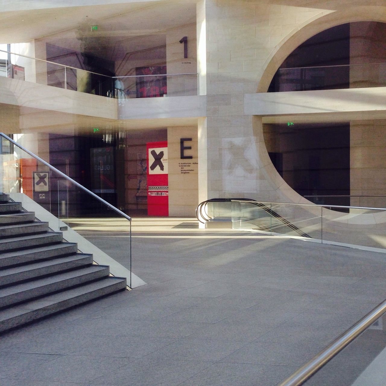 architecture, built structure, building exterior, railing, steps, building, staircase, steps and staircases, window, day, empty, the way forward, no people, city, outdoors, arch, reflection, wall - building feature, sunlight, modern