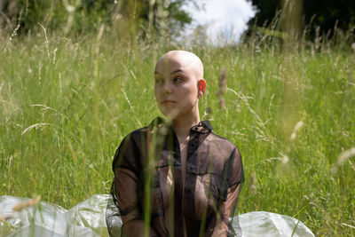 Portrait of teenage girl on field