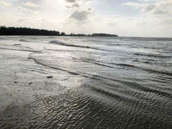 Scenic view of beach against sky