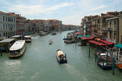 High angle view of canal amidst buildings in city