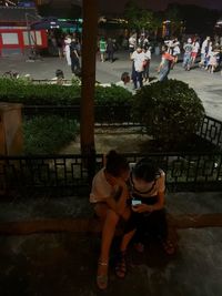 Rear view of women sitting at park