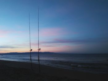 Scenic view of beach against sky during sunset