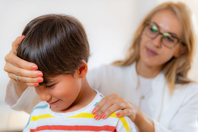 Children physical exam. checking posture and spine development