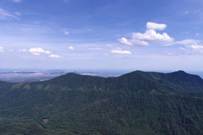 Scenic view of mountains against cloudy sky